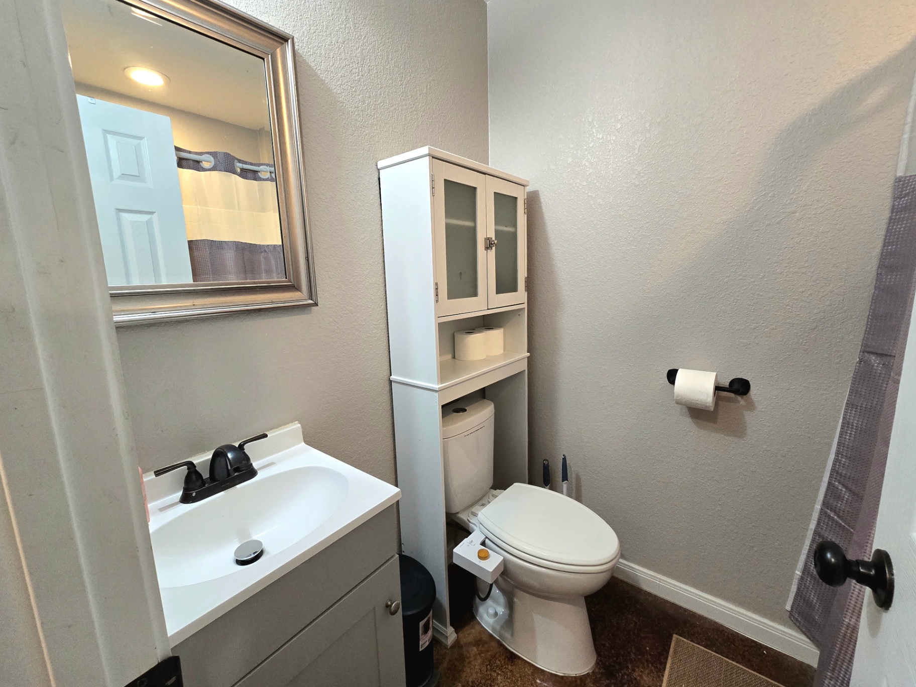 Unit B first bathroom with shower and vanity