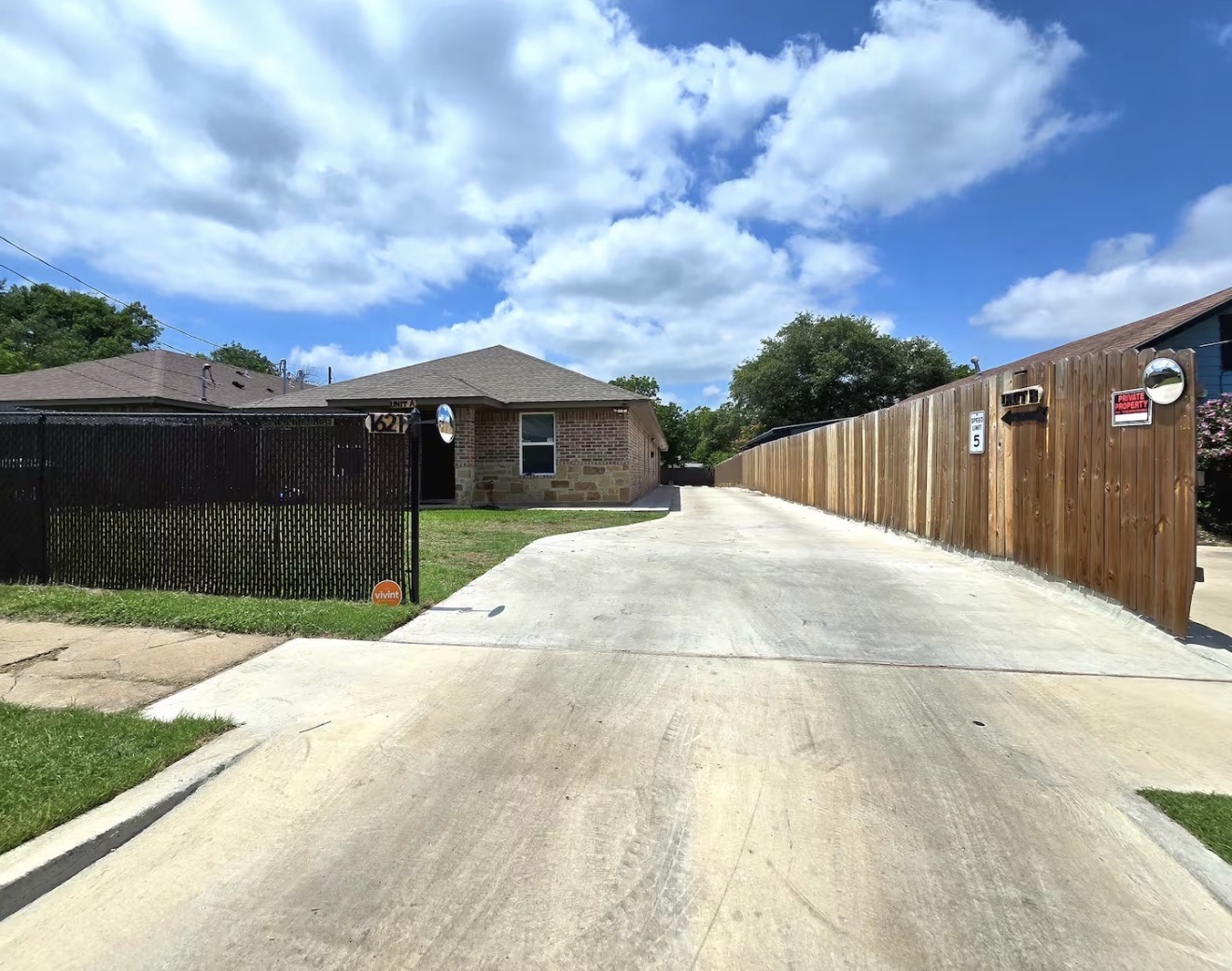 Unit A exterior front view with lawn and driveway
