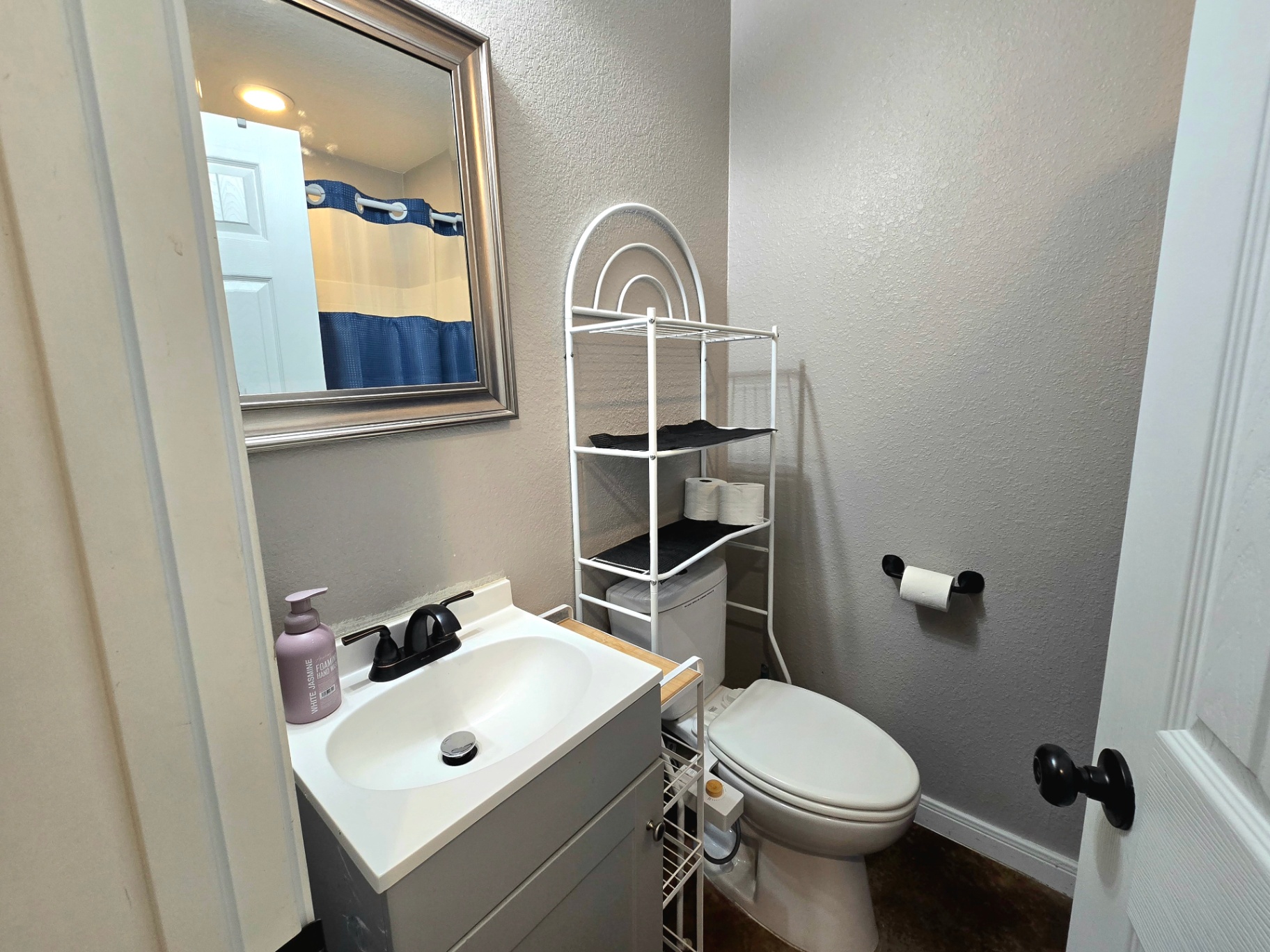 Unit B second bathroom with clean finishes